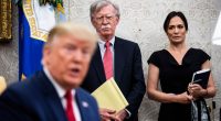 John Bolton and Stephanie Grisham listen as President Trump meets with the Amir of Qatar in the Oval Office.