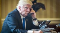 President Donald Trump on the phone in the Oval Office.