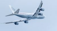 A private Boeing 747-8 taking off.