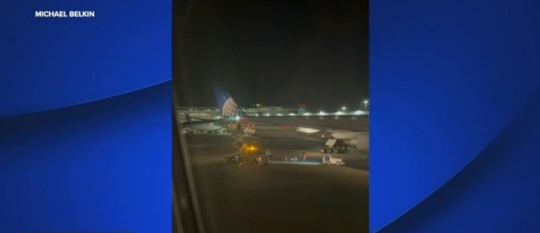 Screenshot of two United Airlines planes with colliding wingtips; no injuries reported.