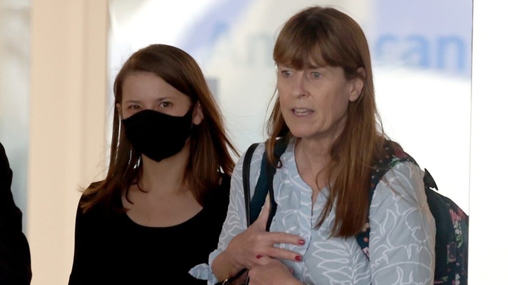 Bindi Irwin holds onto mother Terri as she lands in LA after surgery