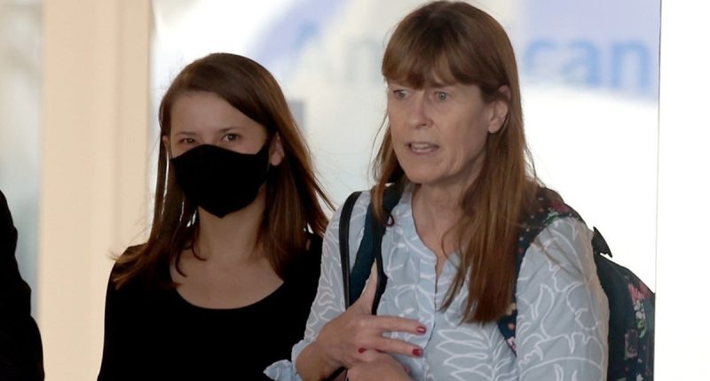 Bindi Irwin holds onto mother Terri as she lands in LA after surgery