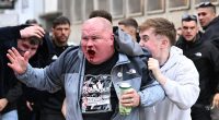 Chaos in Wroclaw: Chelsea fan is set upon by Betis supporters as Conference League build up turns nasty - with Polish police firing water cannons and PEPPER SPRAY at travelling fans