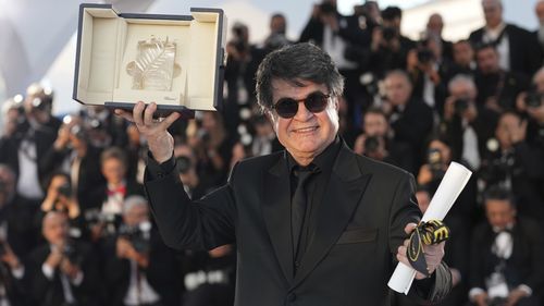 Formerly jailed Iranian filmmaker wins top Cannes award
