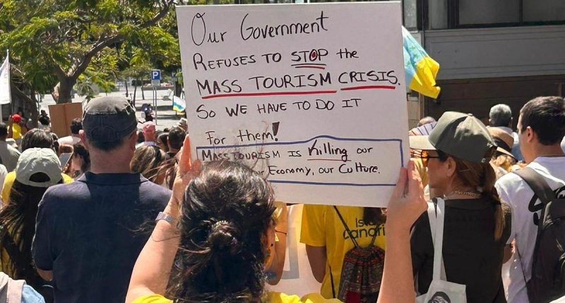 Holidaymakers too scared to leave their rooms as thousands of anti-tourism protesters take to the streets of the Canary Islands