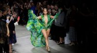 FILE - Actress Jennifer Lopez wears a creation as part of the Versace Spring-Summer 2020 collection, unveiled during the fashion week, in Milan, Italy, Friday, Sept. 20, 2019. (AP Photo/Luca Bruno, File)