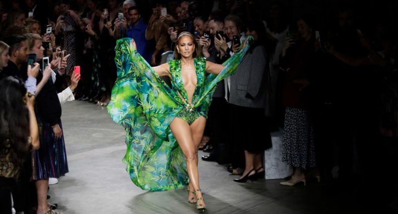 FILE - Actress Jennifer Lopez wears a creation as part of the Versace Spring-Summer 2020 collection, unveiled during the fashion week, in Milan, Italy, Friday, Sept. 20, 2019. (AP Photo/Luca Bruno, File)
