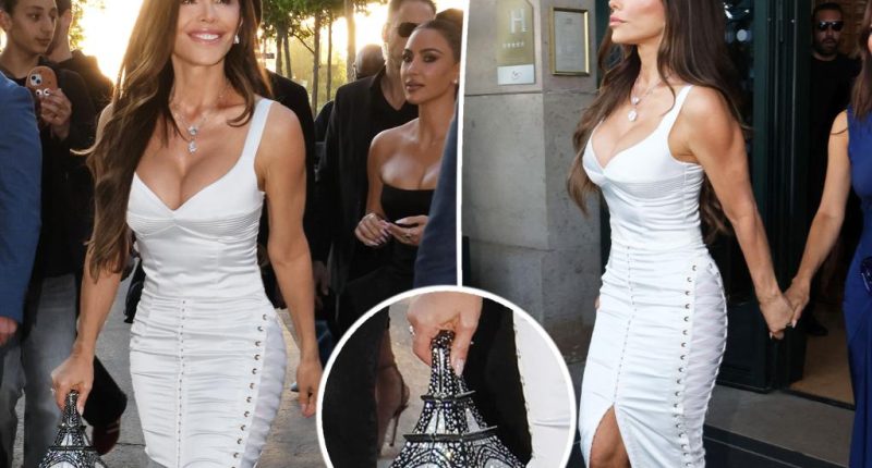 Lauren Sánchez pairs $6,000 Eiffel Tower purse with bridal-white corset and lace-up skirt during Paris bachelorette