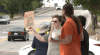 Local group protests union cuts on International Workers Day
