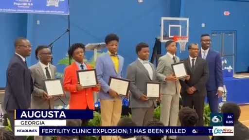 Local middle school boys graduate from mentoring program
