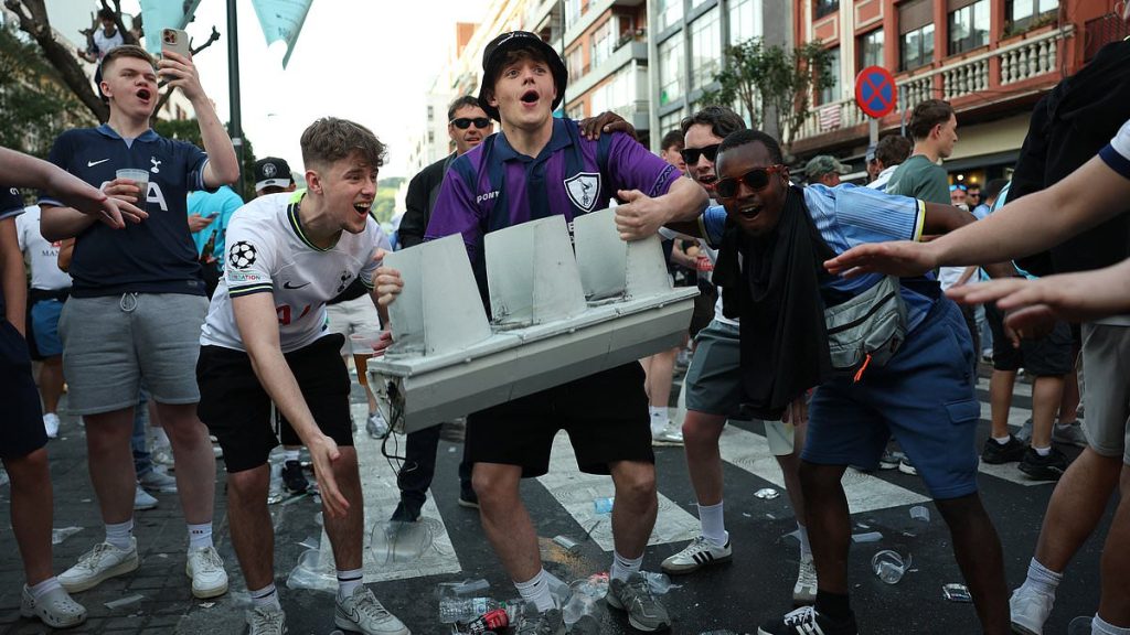 Man Utd and Tottenham yobs clash in the streets, strip naked and throw booze at each other before Europa League final... but meet their match when they take on the locals