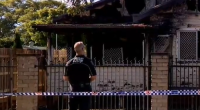A nine-year-old boy is dead and a woman is under police guard after a suspicious house fire in Toowoomba, Queensland. ﻿