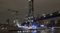 A masted Mexican Navy training ship, the Cuauhtémoc, sits stranded after colliding with the Brooklyn Bridge.