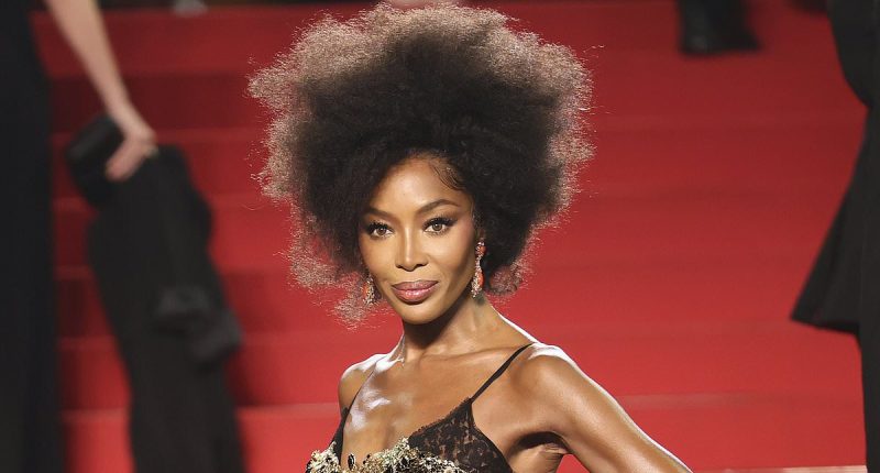 Naomi Campbell, 54, exudes glamour in a black and gold gown in Cannes