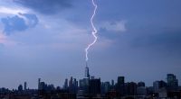 A lightning bolt strikes One World Trade Center during a thunderstorm in New York City on June 22, 2024, as seen from Jersey City, New Jersey. (Photo by Gary Hershorn/Getty Images)