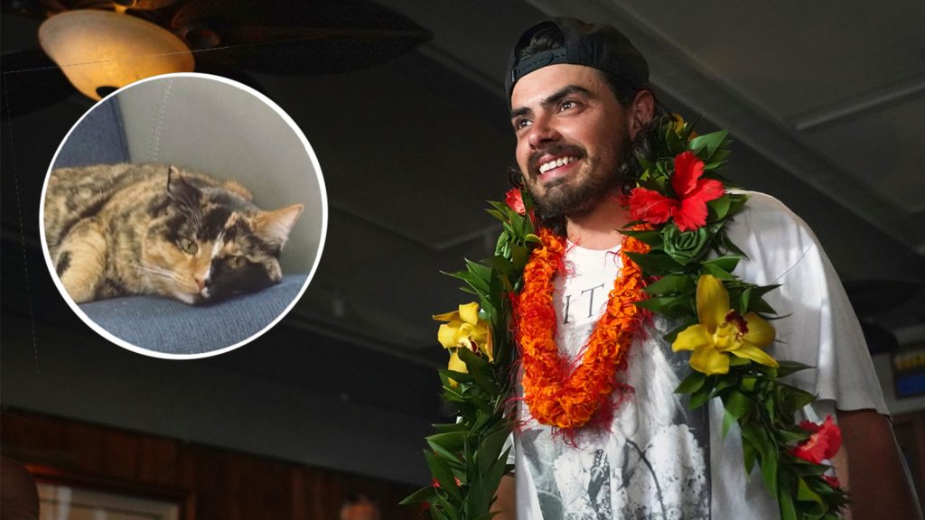 Oregon man, Oliver Widger, who quit his job to set sail with his cat arrives to cheering fans in Oahu, Hawaii