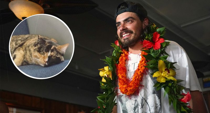 Oregon man, Oliver Widger, who quit his job to set sail with his cat arrives to cheering fans in Oahu, Hawaii