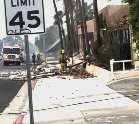 Police and firefighters respond to a car explosion rocking the California city of Palm Springs