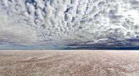 ﻿Kati Thanda-Lake Eyre is a dry salt bed in the lowest point in Australia, sitting 15 metres below sea level, and covers about 9500 square kilometres.