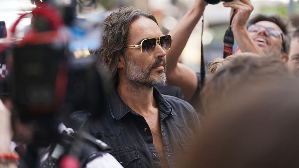 Russell Brand granted conditional bail after appearing in London court on rape and assault charges