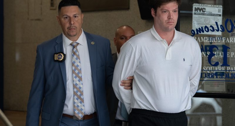 William Duplessie is handcuffed and led away in police custody.