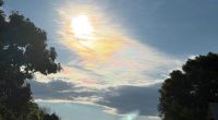 A﻿ Sydney photographer has captured a rarely observed rainbow cloud phenomenon called "irridescent clouds."﻿Maria Milford was driving to the Gold Coast when she spotted the iridescent clouds over the sky in Woolgoolga, NSW.