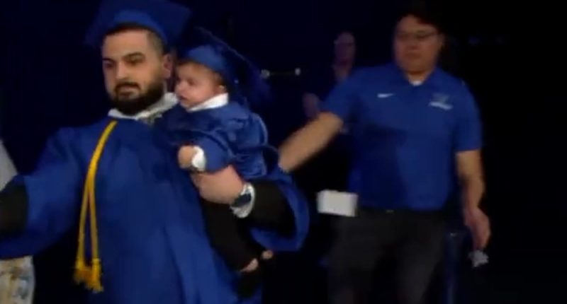 University at Buffalo graduate is chased off stage by police... but school has the last laugh