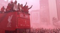 Liverpool Premier League champions on a parade bus.