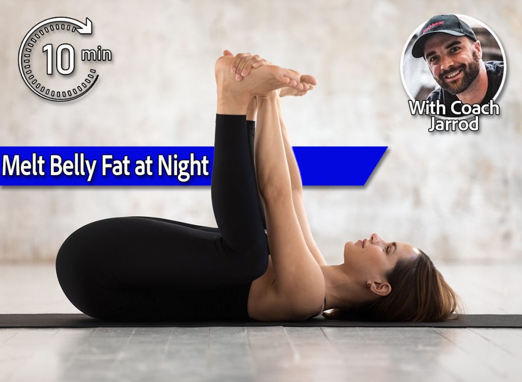 10-Minute Evening Stretch To Melt Belly Fat & Stress Fast. Coach Jarrod. Beautiful woman wearing black sportswear practicing yoga, enjoying, relaxing in Happy Baby pose, doing Ananda Balasana exercise, sporty girl working out at home or in yoga studio with grey walls