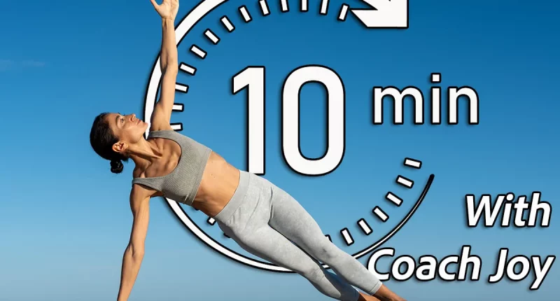 Side plank yoga pose with extended arm under the clear blue sky,