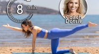 Dotsie Bausch, 5 Gentle Exercises That Loosen Your Body Better Than a Massage for Women Over 40, cover, A woman in blue performs the bird dog pose on a beach, extending one arm and the opposite leg. The serene ocean and distant hills enhance the tranquil setting of this fitness activity.