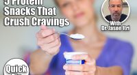5 Protein-Packed Snacks That Killed My Cravings After Menopause. cover. Happy young woman eating yogurt in kitchen