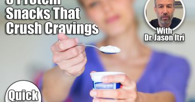 5 Protein-Packed Snacks That Killed My Cravings After Menopause. cover. Happy young woman eating yogurt in kitchen