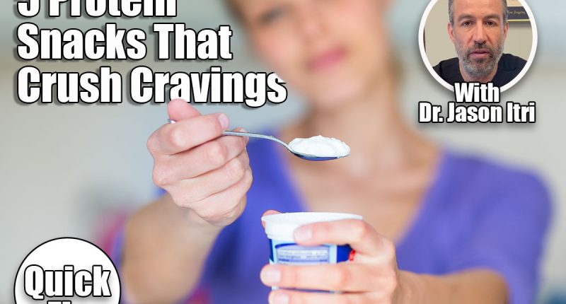 5 Protein-Packed Snacks That Killed My Cravings After Menopause. cover. Happy young woman eating yogurt in kitchen