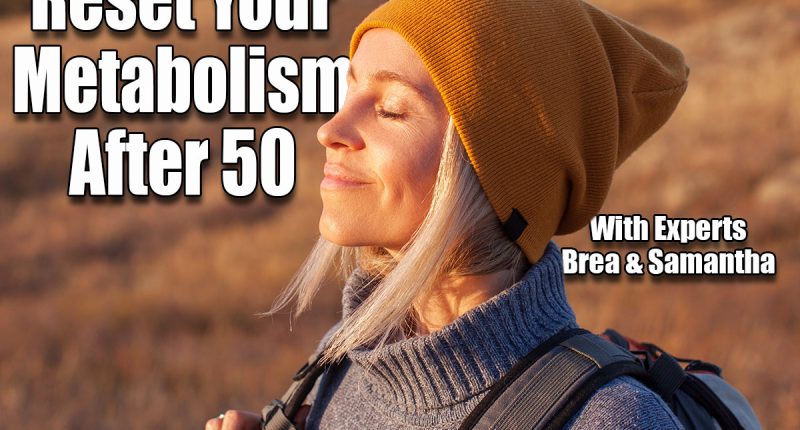 Middle age woman stretching arms breathing fresh air in a forest in autumn. Female traveler spends their vacations going hiking