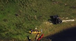 Aerial view of kayakers and a damaged kayak after an alligator attack.