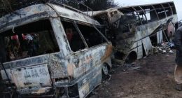 Burned-out buses after a fatal collision.