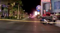 Las Vegas shooting scene with police tape and officers.