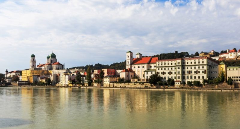 Passau's historic skyline reflected in the Inn River.