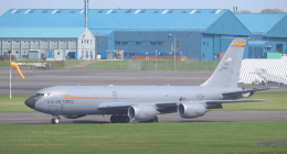 U.S. Air Force plane taxiing on airfield.