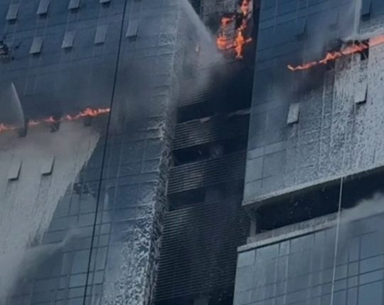 Tethered drones extinguishing a high-rise fire.