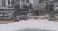 Drone video captures moment giant wave swallows up swimmers on Mexican beach