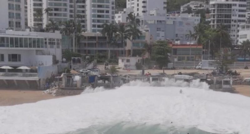 Drone video captures moment giant wave swallows up swimmers on Mexican beach