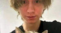 Photo of a young person holding a cat.