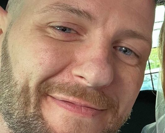 Selfie of a newlywed couple in a car.