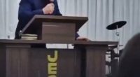 Pastor collapsing during a sermon.