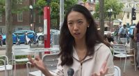 Harvard grad preaches global unity as brawl break out right behind her