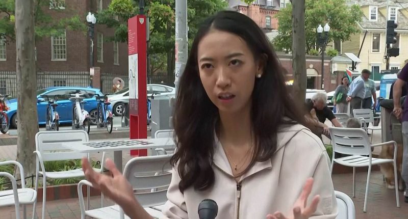 Harvard grad preaches global unity as brawl break out right behind her