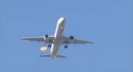 Flames erupting from an airplane in flight.