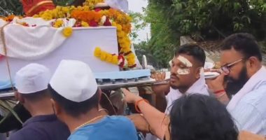 A man carrying his brother's coffin at a funeral procession.